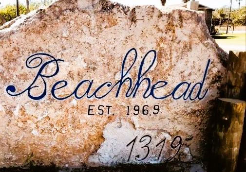 Beachhead Condominiums Beachfront and Ocean View vacation rental homes street marker sign